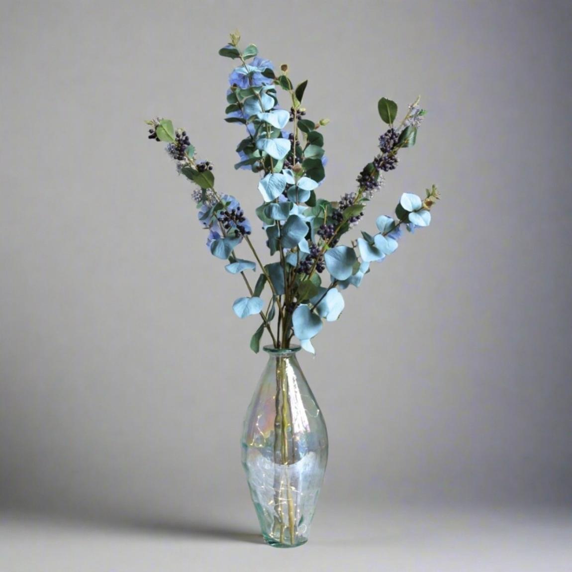 Eucalyptus and Berries in a a Tall Lustre Bottle Vase, with rice lights. main product photo