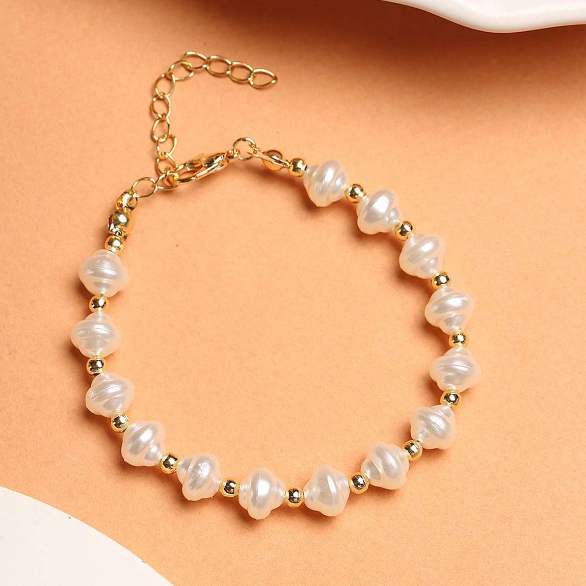 Gold & Row Of Shell Shaped Pearls Bracelet main product photo