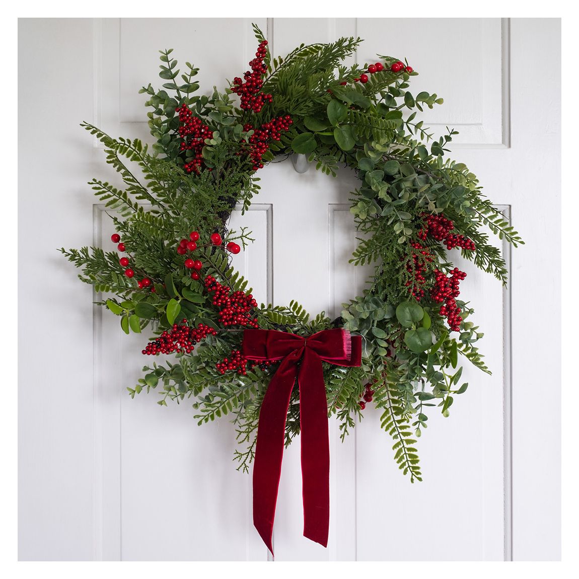 55cm Red Berry, Pine Cone Wreath with Red Velvet Bow main product photo