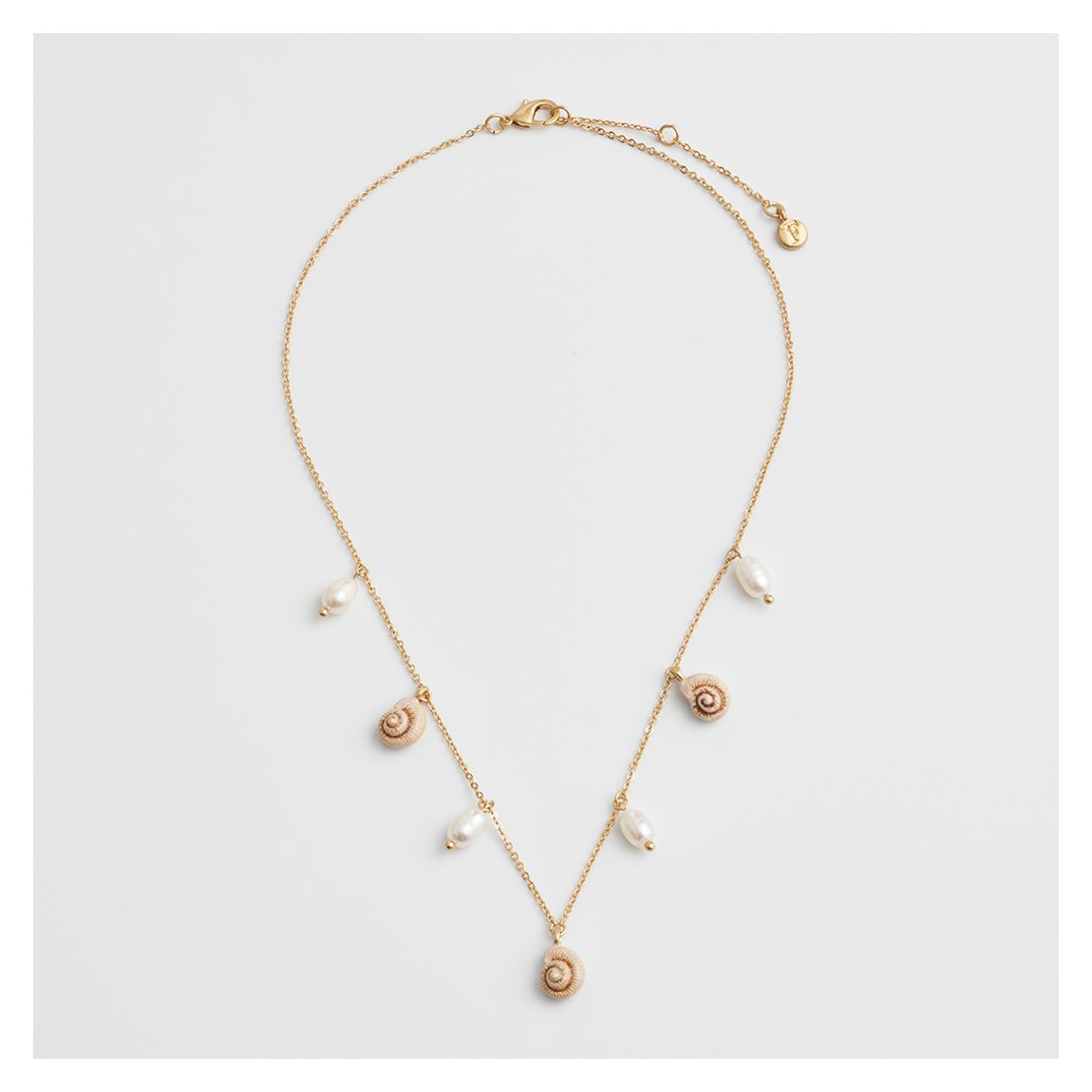 Spiral Shell Charm & Pearl Worn Gold Necklace main product photo
